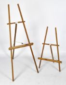 Two wooden artist's easels,