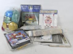 A selection of assorted cross stitch and sewing related components,