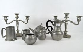 A pair of silver plated candlesticks, with moulded decoration of fruit and scrolls, height 25cm,