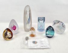 A collection of assorted glass paperweights, including one by Caithness and another by Glasform,