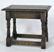 A carved oak joint stool, of rectangular form,