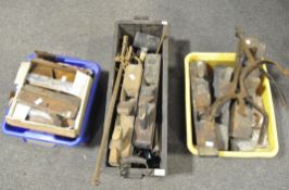 A collection of vintage tools including planes, drills,
