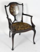 An Edwardian armchair, the back roundel decorated with various coloured inlays,