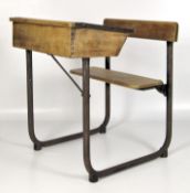 A mid-century pine school desk with fitted chair,