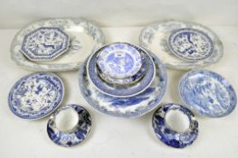 A collection of blue and white ceramics including serving platters,