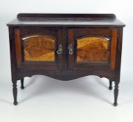 A stained wooden two door sideboard, raised upon turned supports, 81cm x 104cm x 51cm,