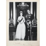 A signed black and white photograph of Elizabeth II and Prince Phillip, dated 1961,