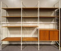 A Ladderax shelving unit with white shelves, mid-century,