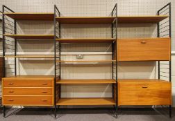 A Ladderax shelving unit, with black shelving, mid-20th century, with two teak fall front cupboards,