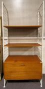 A Ladderax shelving unit with white shelves, mid-century,
