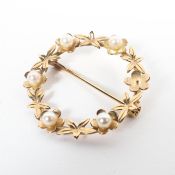 A 9ct gold wreath design brooch set with seed pearls