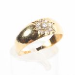 An 18ct gold band star set with nine old cut diamonds, 3.0g. Size K.