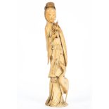 A Chinese carved ivory figure,19th century, of a maiden holding a peach branch,