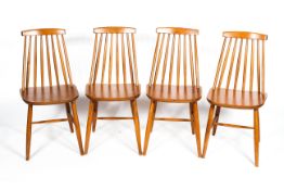 Four Ercol style spindle back chairs in light elm and beech, on tapering legs, 80.