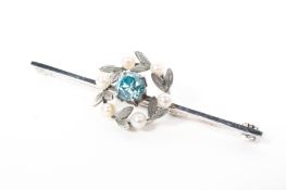 A 9ct white gold aquamarine and pearl set wreath brooch, 2.7g.