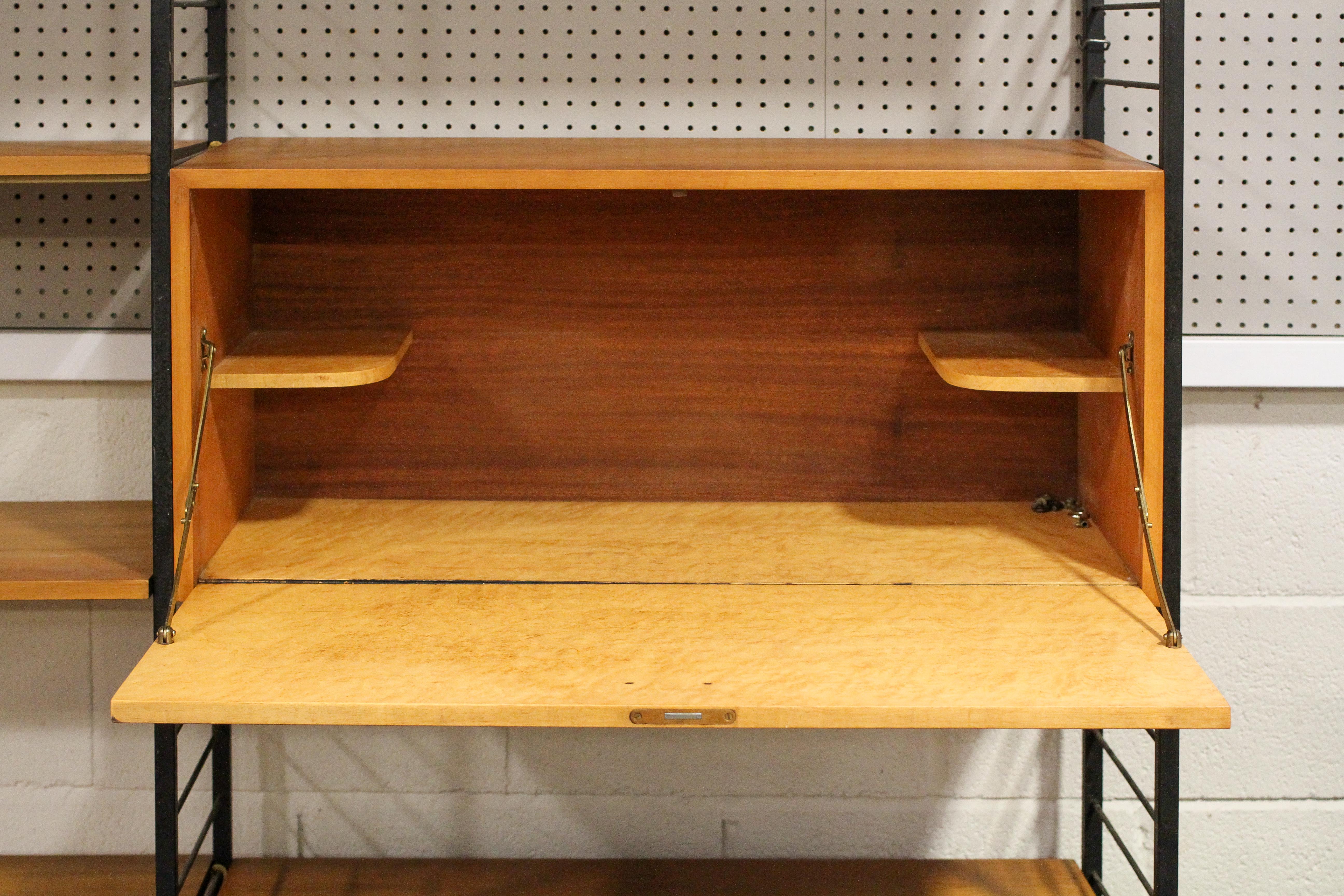 A Ladderax shelving unit, with black shelving, mid-20th century, with two teak fall front cupboards, - Image 3 of 5