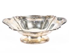 A George V silver dish, the flowing border with pierced and engraved ribbon decoration,