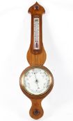 A Victorian (R Sheffield Rhyl) aneroid banjo-shaped barometer, with thermometer,