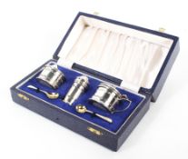 A mid-century three piece silver condiment set, comprising lidded mustard,