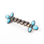 An unmarked yellow metal diamond and turquoise bar brooch