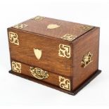 An Edwardian oak brass-mounted stationery box, stamped Rd 384841 to one drawer,