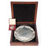 A Victorian silver salver in box together with a silver-plated presentation medal,