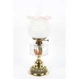 An Edwardian brass mounted oil lamp, the burner marked for Wright & Butler, Birmingham,