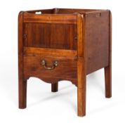 A Georgian mahogany pot cupboard with galleried top above tambour front cupboard and pull-out pot