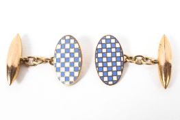 A pair of 9ct gold and enamel bullet backed oval cuff links. 4g.