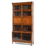 An oak five tier Globe Wernicke style bureau bookcase, circa 1920, with leaded glazed double doors,
