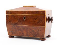 A Georgian burr walnut sarcophagus shaped tea caddy and cover, inlaid with satinwood stringing,