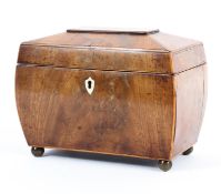 A Georgian sarcophagus shaped mahogany tea caddy, inlaid with satinwood stringing,