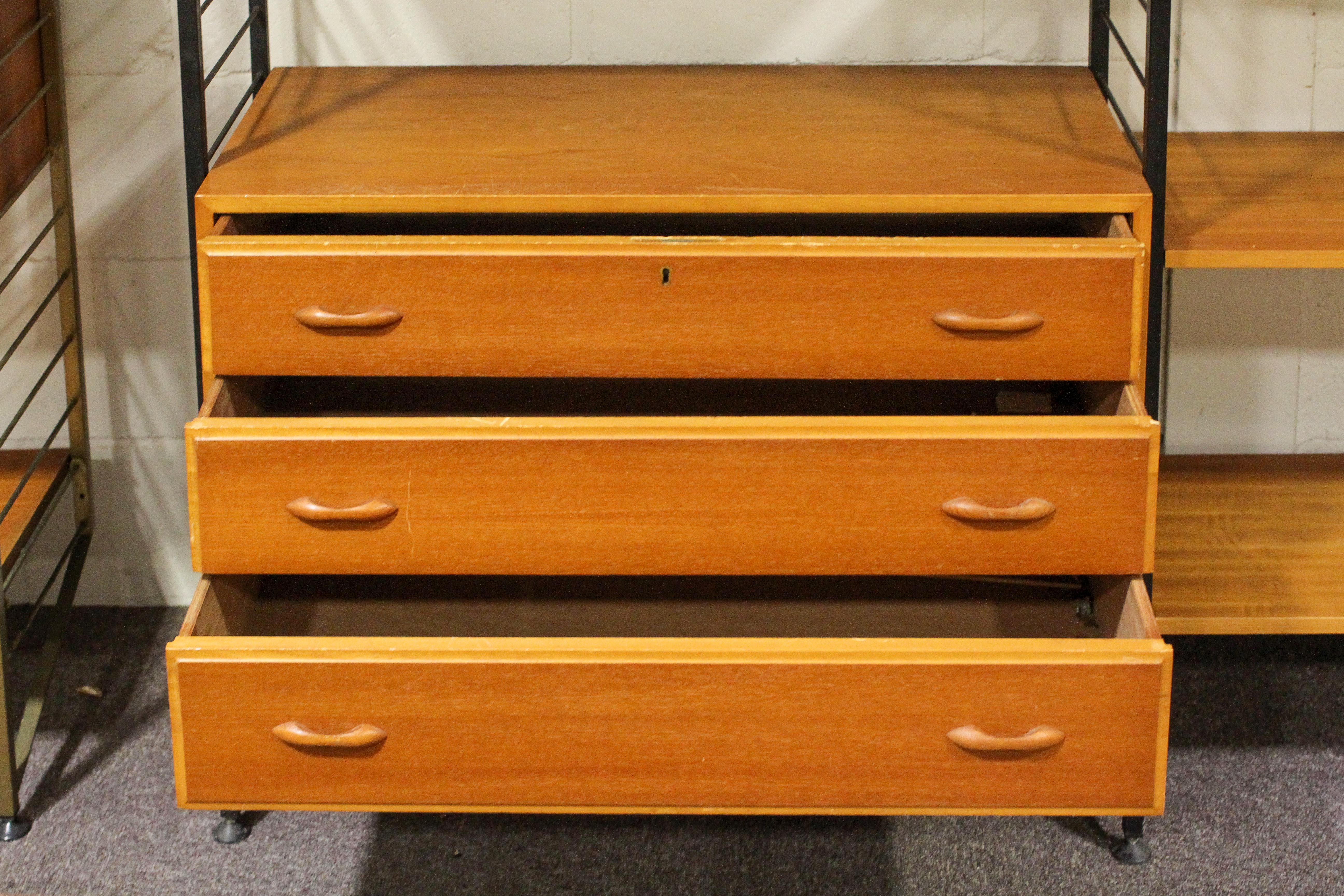 A Ladderax shelving unit, with black shelving, mid-20th century, with two teak fall front cupboards, - Image 5 of 5