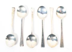 A set of six silver demi-tasse tea spoons,