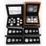 Six boxed silver and proof coin sets to include four, four-coin silver proof sets.