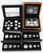 Six boxed silver and proof coin sets to include four, four-coin silver proof sets.