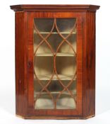 A Sheraton style mahogany and line inlaid corner cabinet, with astragal glazing,
