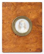 A Victorian portrait miniature of a girl on ivory, in burr oak frame