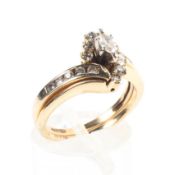 A 14ct gold and diamond double interlocking dress ring central marquis cut diamond with single cut