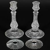 A pair of Baccarat hobnail cut glass candlesticks of baluster form with separate drip pans,