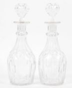 A pair of early to mid 19th century decanters and stoppers, each of baluster form,