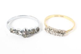 An 18ct gold and platinum illusion set diamond ring together with a paste set ring. Size 0.
