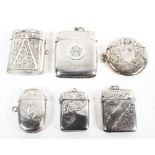 A collection of six hallmarked silver vesta cases,