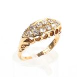 An 18ct gold and diamond ring set with double line of single cut diamonds, 3.7g. Size L.
