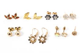 A collection of seven pairs of 9ct gold and unmarked yellow metal stud earrings