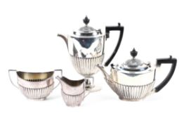 An Edwardian silver four piece tea set, hallmarked Sheffield 1910 by Roberts & Belk,