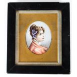 A Continental porcelain oval portrait plaque of a young lady, late 19th century, in glazed frame,