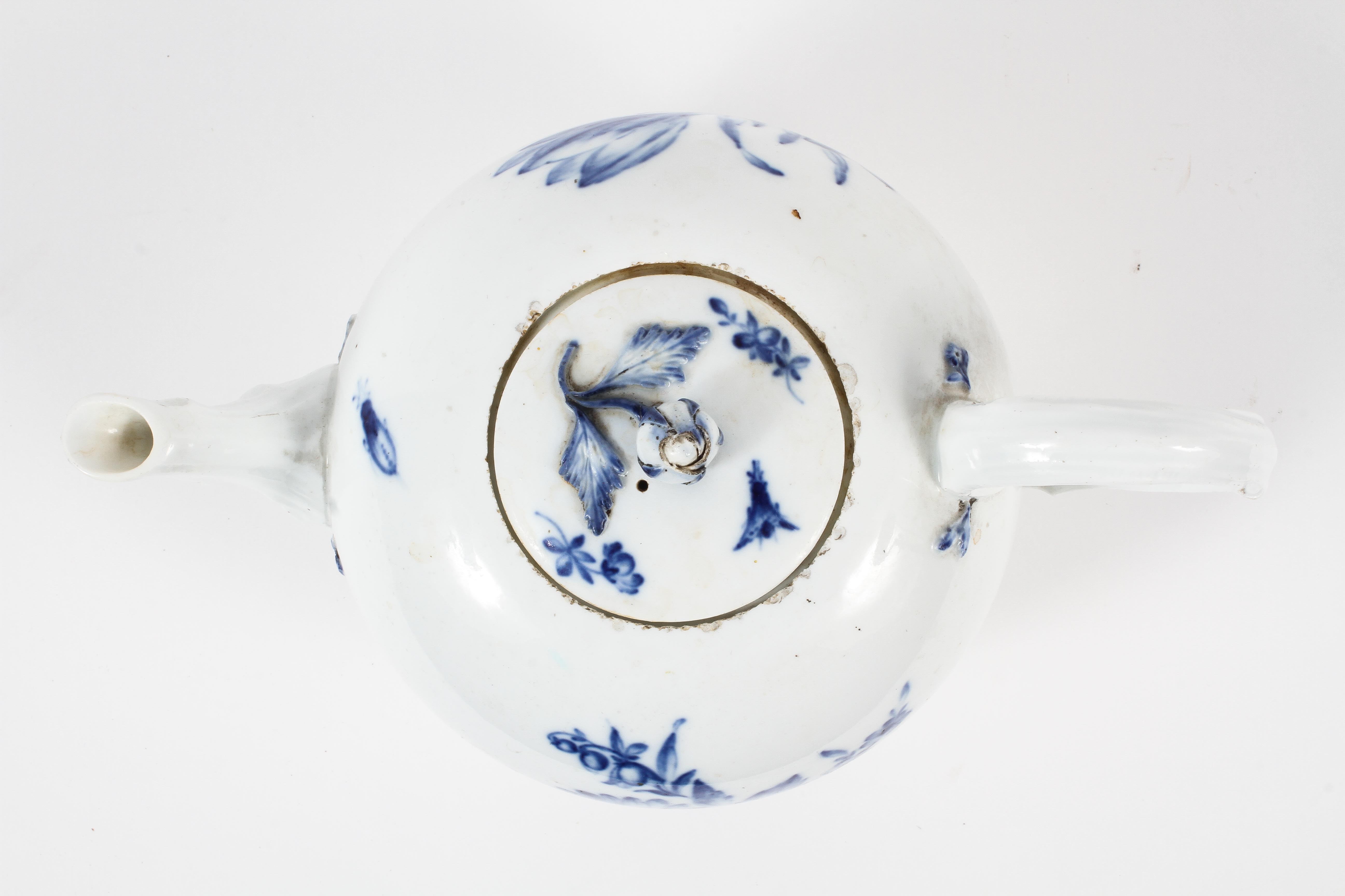 A Meissen teapot and a cover, mid-19th century, blue crossed swords marks painted 63. - Image 2 of 3