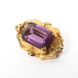 A 19th century unmarked yellow metal and amethyst brooch set with single step cut amethyst. 2.2g.