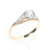 An Art Deco style 18ct gold and platinum diamond set ring